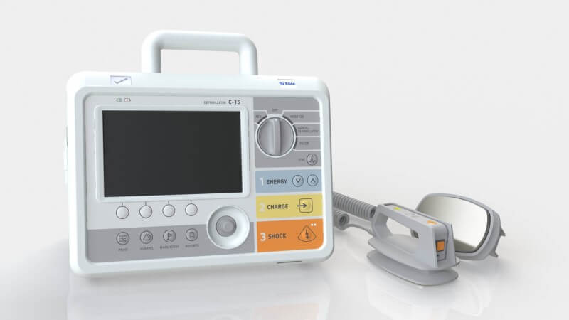 Front image of C-15 defibrillator with adult external paddles